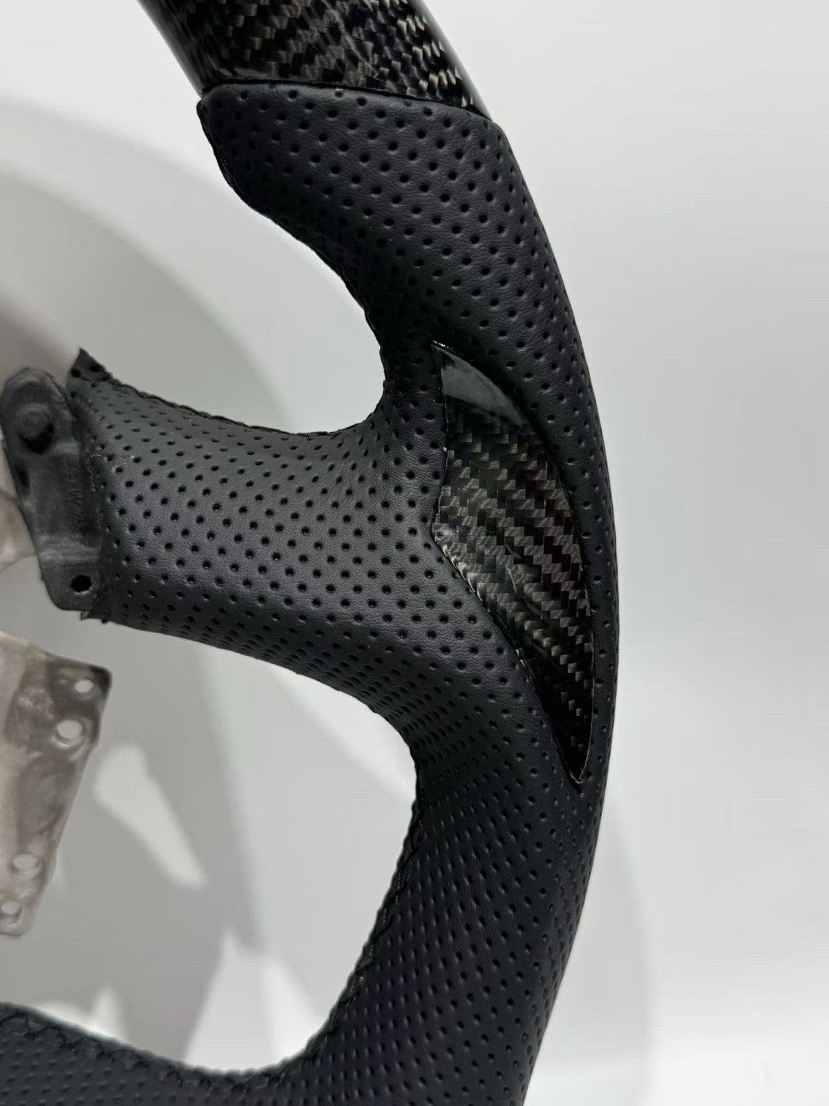 Rear of Ford Falcon FG FGX all black steering wheel showing factory control mounting points