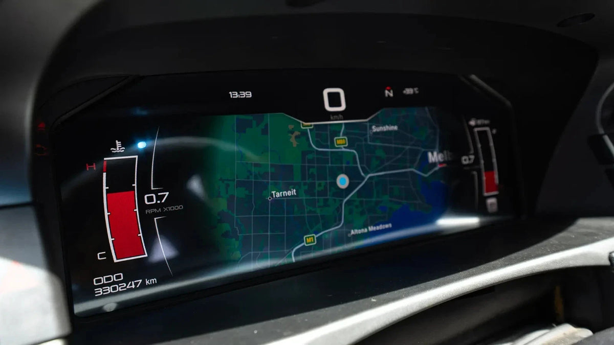 Digital instrument cluster active display showing speedometer and navigation map in a Ford BA/BF Ghia SX/SY Territory