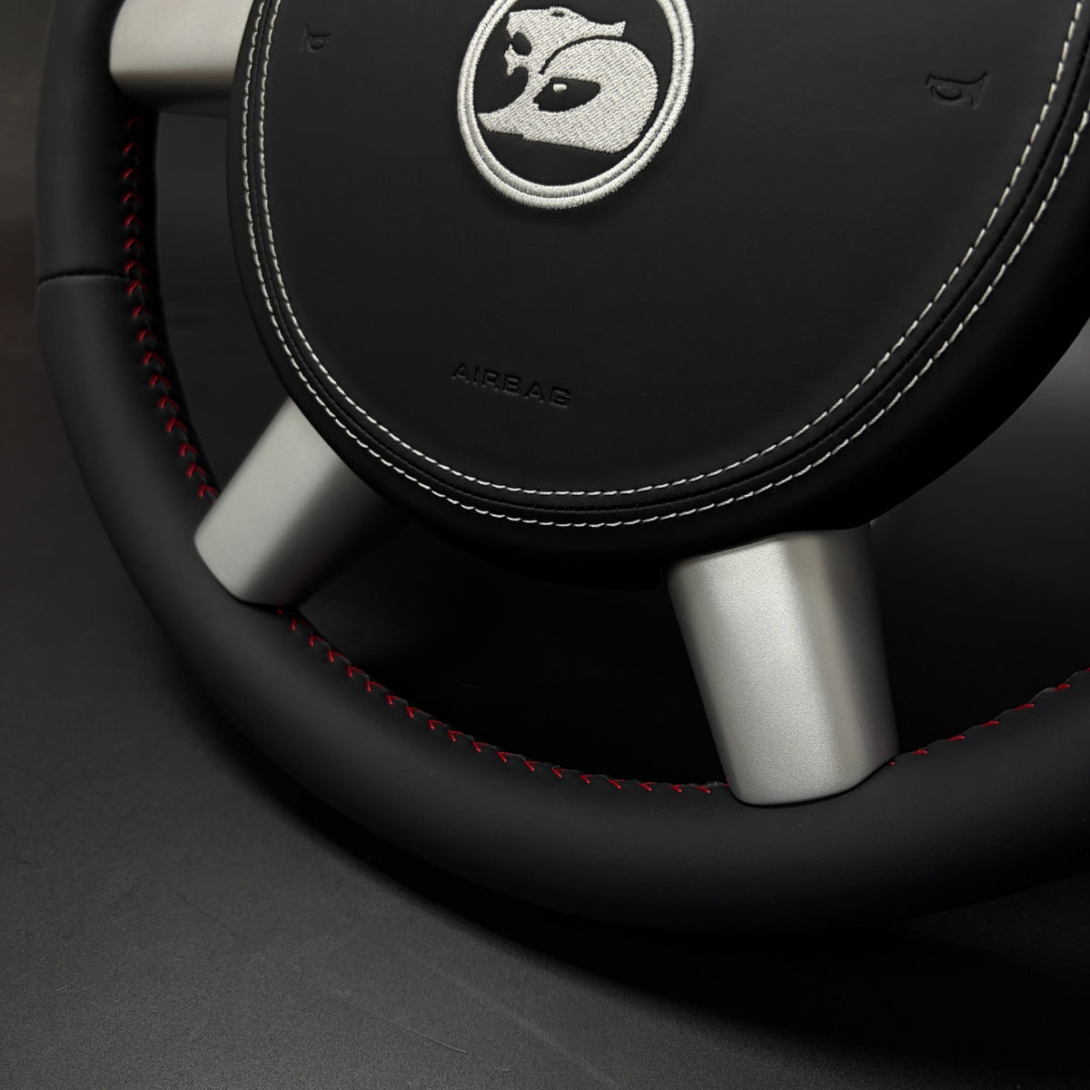 Close-up of leather grip and stitching on Holden VY VZ Monaro steering wheel