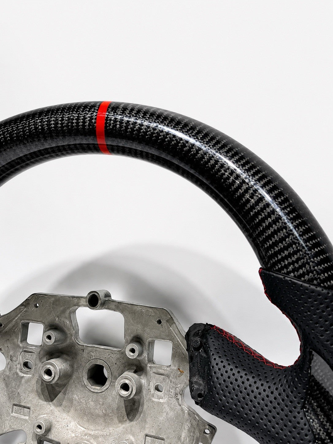 Rear view of Ford Falcon FG FGX carbon steering wheel showing factory control mounting points