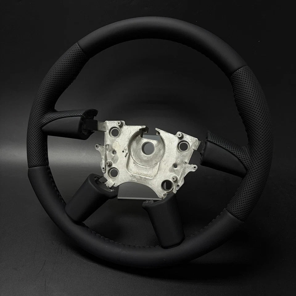 Close-up of leather grip and stitching on Holden VY VZ steering wheel